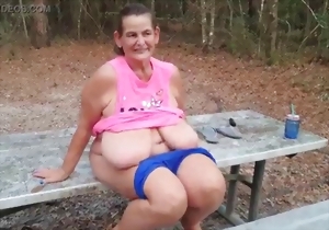 Sexy as fuck mature shows off her gigantic natural boobies